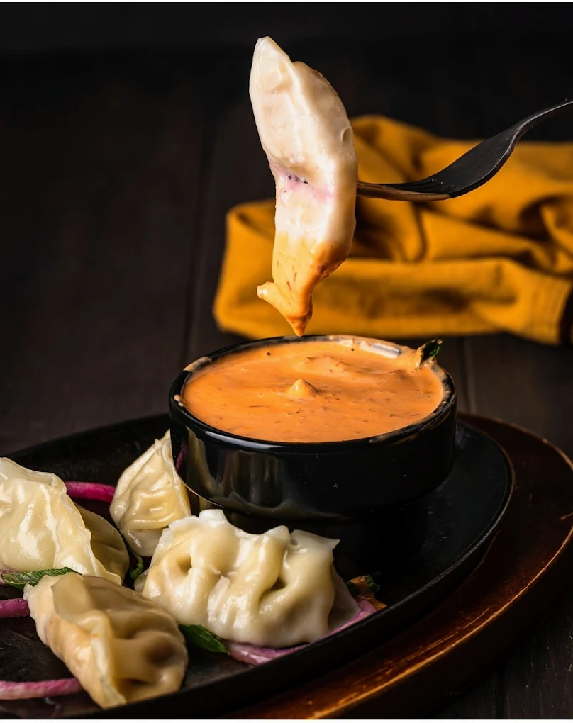 Steamed chicken momos with spicy dip at Sector 17 in Calgary NE